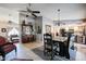 Open-concept dining room with table and chairs, and decorative hutch at 556 W Kiva Ave, Mesa, AZ 85210