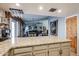 Modern kitchen with granite countertops, brick elements, and open floorplan views at 556 W Kiva Ave, Mesa, AZ 85210