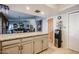 Kitchen island with granite countertop and ample cabinet space at 556 W Kiva Ave, Mesa, AZ 85210