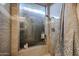 Tiled shower stall with glass door, updated fixtures, and shower products at 556 W Kiva Ave, Mesa, AZ 85210