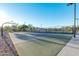 Community basketball court with hoop, painted lines, and surrounding fences and landscaping at 5741 E Star Valley St, Mesa, AZ 85215