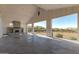 Covered outdoor space with fireplace and view of the lawn at 5741 E Star Valley St, Mesa, AZ 85215