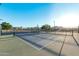 Outdoor pickleball court with painted lines and net in a residential community on a sunny day at 5741 E Star Valley St, Mesa, AZ 85215