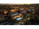 Stunning aerial view of a home with a private pool and lush backyard at dusk at 586 E Stirrup Ln, San Tan Valley, AZ 85143