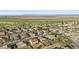 Aerial view of a well-planned community featuring residential homes and agricultural land at 586 E Stirrup Ln, San Tan Valley, AZ 85143
