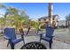 Inviting backyard patio featuring comfortable seating and a fire pit, creating a cozy outdoor gathering space at 586 E Stirrup Ln, San Tan Valley, AZ 85143