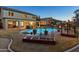 Expansive backyard featuring a large pool, covered patio, hot tub, and lush landscaping at 586 E Stirrup Ln, San Tan Valley, AZ 85143