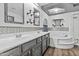 Well-lit bathroom with double sinks, decorative mirrors, and a luxurious soaking tub at 586 E Stirrup Ln, San Tan Valley, AZ 85143