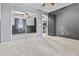 Bedroom with gray carpet, ceiling fan, and mirrored closet at 586 E Stirrup Ln, San Tan Valley, AZ 85143