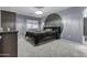 Large bedroom with dark wood furnishings and ample natural light from a large window at 586 E Stirrup Ln, San Tan Valley, AZ 85143