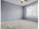 Comfortable bedroom with soft carpeting and a large window for natural light at 586 E Stirrup Ln, San Tan Valley, AZ 85143