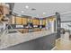 The beautifully designed kitchen offers stainless steel appliances and lots of counter space for cooking and dining at 586 E Stirrup Ln, San Tan Valley, AZ 85143