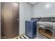 Laundry room features modern washer and dryer units in a well-lit space at 586 E Stirrup Ln, San Tan Valley, AZ 85143