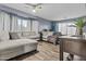 A cozy living room featuring a large sectional sofa, neutral decor, and plenty of space for relaxation at 586 E Stirrup Ln, San Tan Valley, AZ 85143