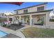The covered patio offers a comfortable outdoor living space with stylish furniture and a serene view at 586 E Stirrup Ln, San Tan Valley, AZ 85143