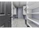 Spacious walk-in closet features ample shelving and storage at 586 E Stirrup Ln, San Tan Valley, AZ 85143