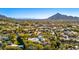 Stunning aerial view showcasing the neighborhood with lush greenery and striking mountain views at 6602 N 40Th St, Paradise Valley, AZ 85253