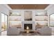 Bright living room with a cozy fireplace, decorative shelves and large window views at 6602 N 40Th St, Paradise Valley, AZ 85253