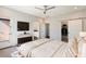 Comfortable bedroom with a sliding barn door closet and en-suite bathroom entrance at 6990 E 6Th St # 1016, Scottsdale, AZ 85251