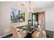 Bright dining room with a marble table, seating for six, and a view of the outdoors at 6990 E 6Th St # 1016, Scottsdale, AZ 85251