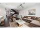 A cozy living room with a plush couch, modern staircase, and stylish decor at 6990 E 6Th St # 1016, Scottsdale, AZ 85251