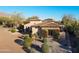 An aerial view of a desert community with an immaculate golf course and lush landscaping at 8057 E Greythorn Dr, Gold Canyon, AZ 85118