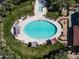 Aerial view of the community's luxury pool area with ample seating, lush landscaping, and resort amenities at 8057 E Greythorn Dr, Gold Canyon, AZ 85118