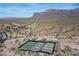 Aerial view of community pickleball and tennis courts with mountain views, active lifestyle amenities at 8057 E Greythorn Dr, Gold Canyon, AZ 85118
