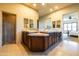 Bright bathroom featuring a double vanity, tiled countertop, and a walk-in shower with glass door at 8057 E Greythorn Dr, Gold Canyon, AZ 85118