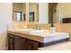 Close-up of a bathroom vanity with decorative tile countertop, sink, chrome faucet, and ample storage at 8057 E Greythorn Dr, Gold Canyon, AZ 85118