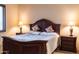 Spacious bedroom boasts a wooden bed frame, matching nightstands, and natural lighting at 8057 E Greythorn Dr, Gold Canyon, AZ 85118