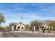 Stone entrance with American flag welcomes you to this picturesque community at 8057 E Greythorn Dr, Gold Canyon, AZ 85118