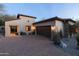 Elegant home with a paver driveway, attached garage, and beautiful desert landscaping at 8057 E Greythorn Dr, Gold Canyon, AZ 85118