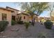 A traditional, landscaped front yard with a walkway leading to the entry at 8057 E Greythorn Dr, Gold Canyon, AZ 85118