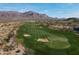 Rolling green golf course nestled in a desert landscape with scenic mountain backdrop at 8057 E Greythorn Dr, Gold Canyon, AZ 85118