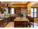 Gourmet kitchen featuring granite countertops, stainless steel appliances, and custom cabinetry at 8057 E Greythorn Dr, Gold Canyon, AZ 85118