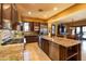 Gourmet kitchen featuring stainless steel appliances, granite countertops, and a large island at 8057 E Greythorn Dr, Gold Canyon, AZ 85118