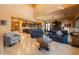 Open-concept living room featuring high ceilings, tile flooring, and a seamless transition to the kitchen and dining areas at 8057 E Greythorn Dr, Gold Canyon, AZ 85118
