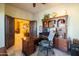 Spacious office features a large desk with storage and lots of natural light at 8057 E Greythorn Dr, Gold Canyon, AZ 85118