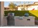 Built-in outdoor grill area with stainless steel appliances for enjoyable outdoor cooking and entertaining at 8057 E Greythorn Dr, Gold Canyon, AZ 85118