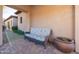 Cozy outdoor patio featuring brick flooring and cushioned wicker seating, perfect for relaxing outdoors at 8057 E Greythorn Dr, Gold Canyon, AZ 85118