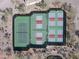 Aerial view of fenced pickleball courts offering residents a place to socialize and exercise at 8057 E Greythorn Dr, Gold Canyon, AZ 85118