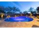 Breathtaking backyard featuring a pool, spa, and desert landscaping, perfect for a serene and luxurious outdoor living experience at 8057 E Greythorn Dr, Gold Canyon, AZ 85118