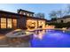 Gorgeous outdoor space with a pool, a built-in spa, and a covered patio with dining and lounging areas at 8057 E Greythorn Dr, Gold Canyon, AZ 85118