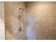 Modern shower with a rainfall showerhead and seamless tile walls, creating a clean and elegant space at 8057 E Greythorn Dr, Gold Canyon, AZ 85118