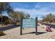 Community directional signage for the sports club amidst desert landscaping, with a clear blue sky at 8057 E Greythorn Dr, Gold Canyon, AZ 85118