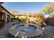 Pool view with the jacuzzi in the foreground and desert landscaping at 8057 E Greythorn Dr, Gold Canyon, AZ 85118