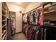 Organized walk-in closet with ample shelving and hanging space for clothes and accessories at 8057 E Greythorn Dr, Gold Canyon, AZ 85118