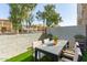 Private backyard patio with artificial grass provides an inviting outdoor space at 8255 N 22Nd Dr, Phoenix, AZ 85021