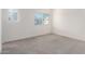 Bright bedroom with neutral carpet, and dual windows offering natural light at 8255 N 22Nd Dr, Phoenix, AZ 85021